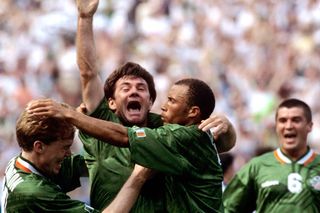 Ray Houghton is mobbed by his team-mates after scoring the only goal of the game in New Jersey.