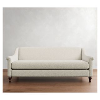 Cream boucle couch with wooden turned feet