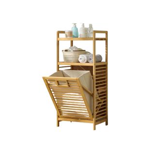 A wooden laundry hamper with 2-Tier Shelves and toiletries on top of the laundry basket itself