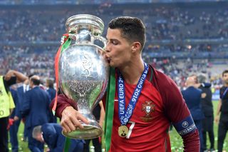 Cristiano Ronaldo kisses the European Championship trophy after Portugal's victory over France at Euro 2016.