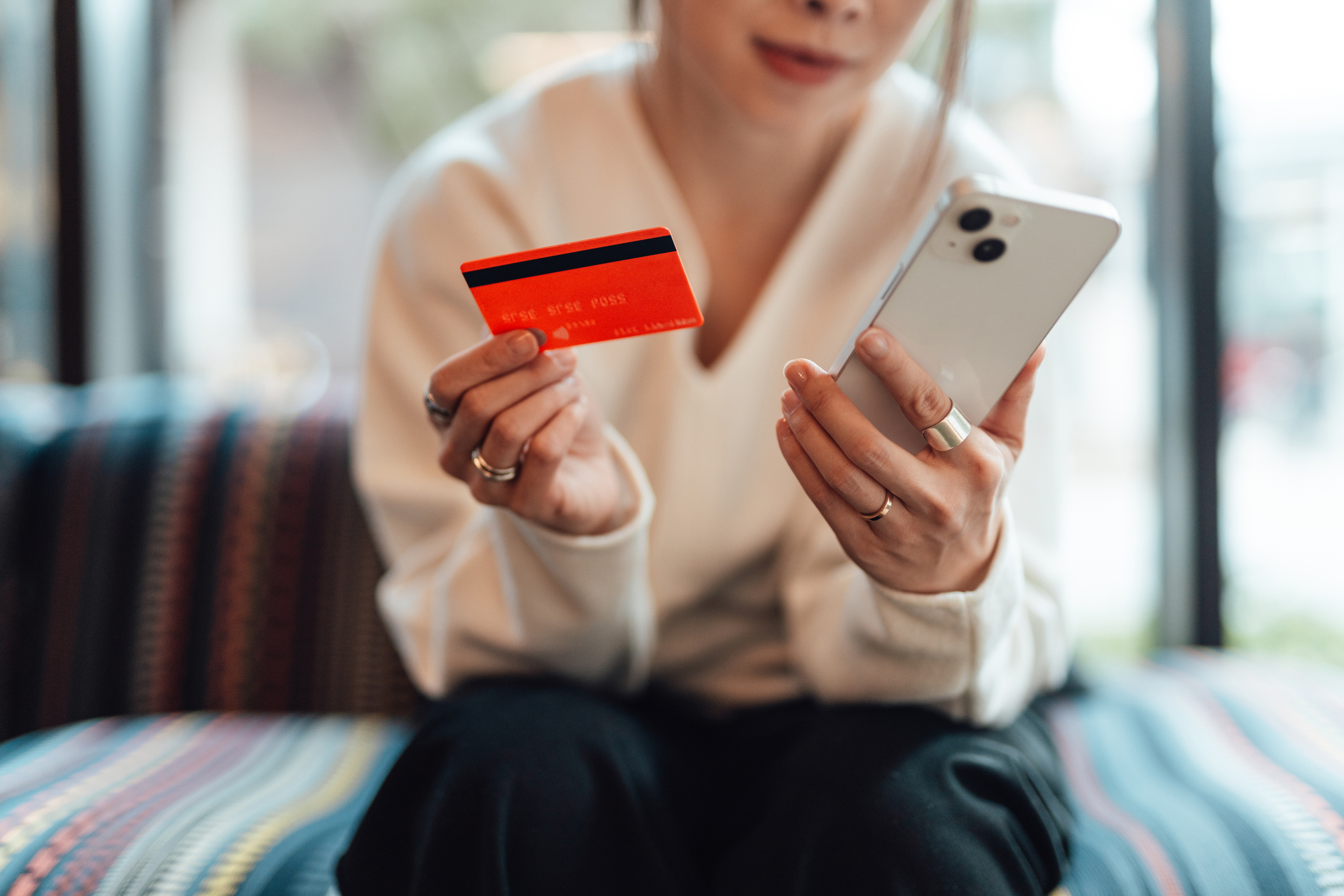 woman making card payment via smartphone