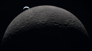 The upper half of the moon, partially lit, with a small crescent-shaped Earth in the background