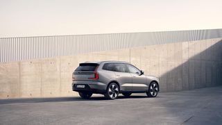 Volvo EX90 SUV from side and rear