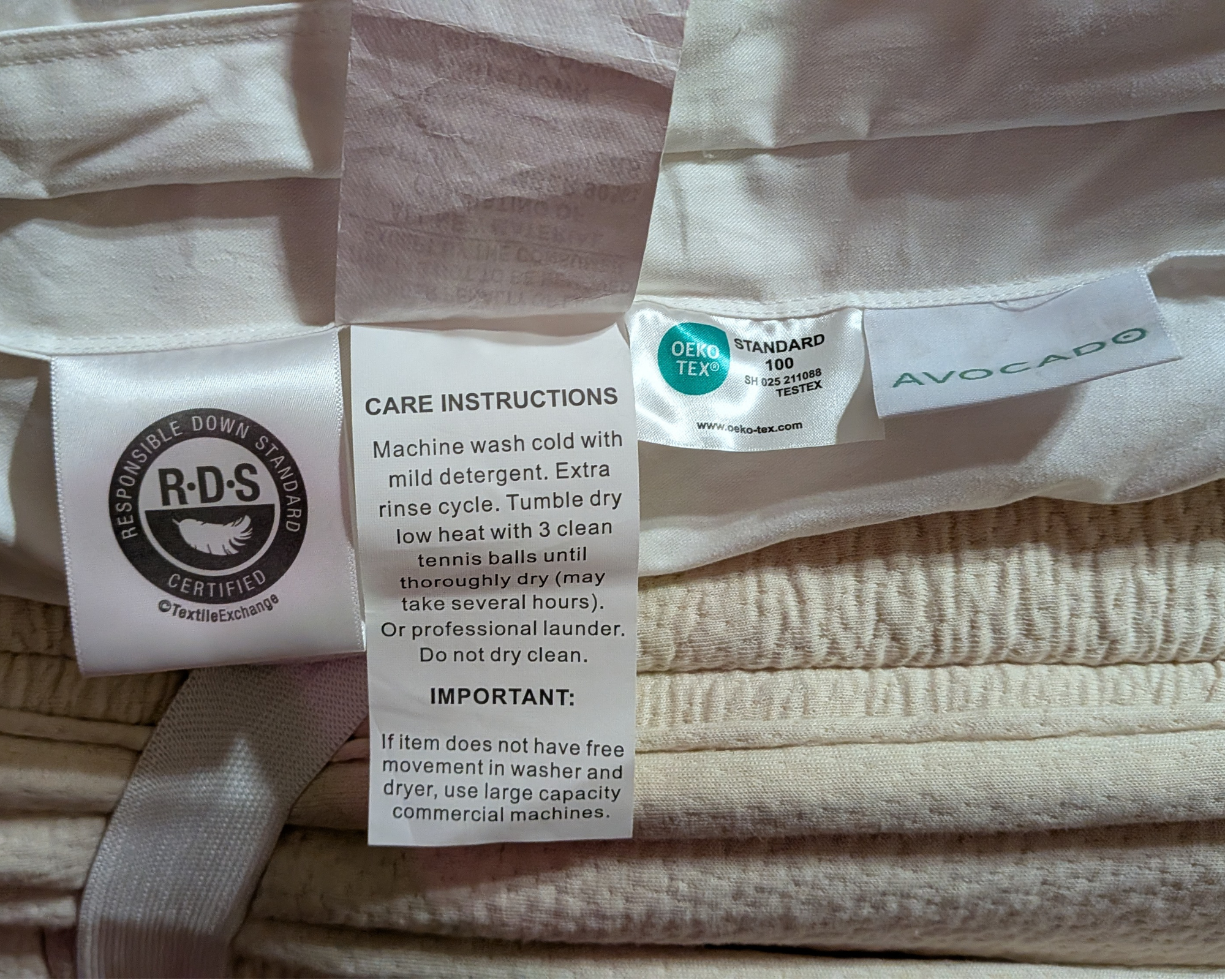 The care label on the Avocado Down Mattress Topper.