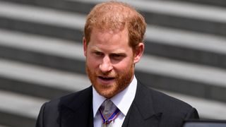 Prince Harry leaves after attending the National Service of Thanksgiving