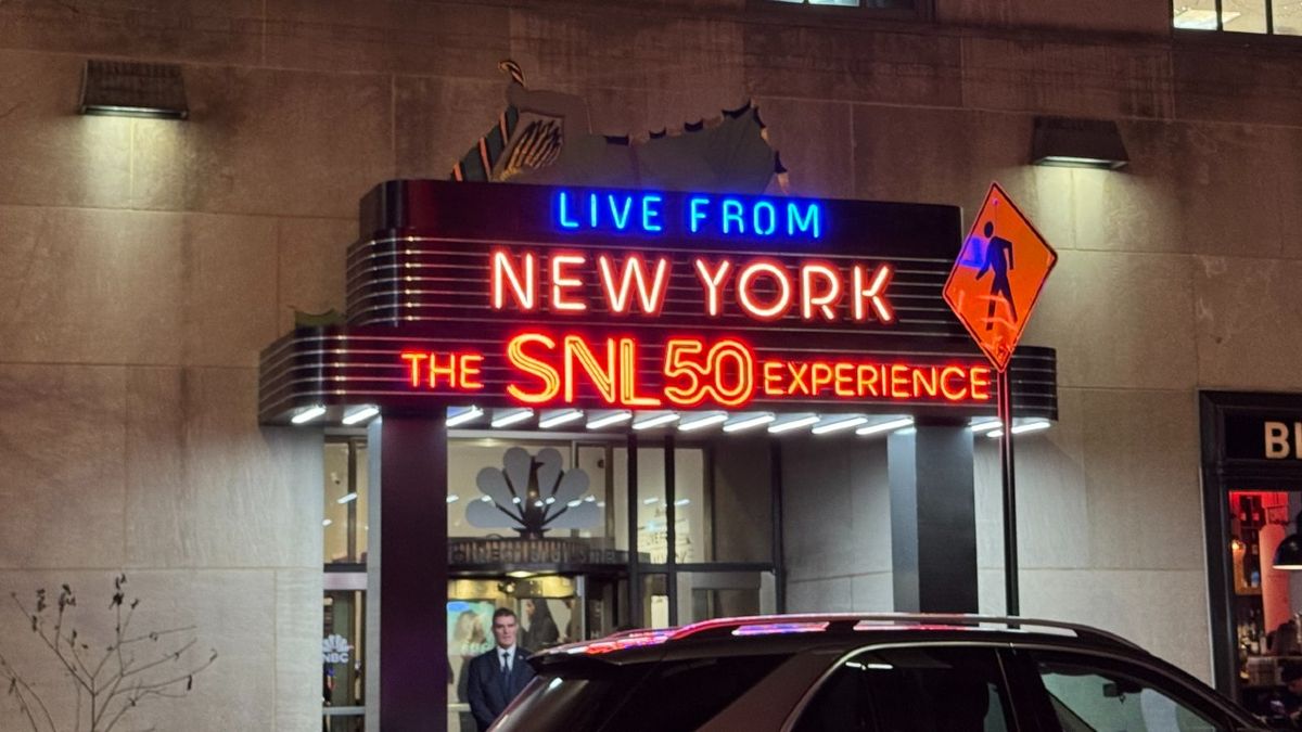 The outside neon sign that says: &quot;Live from New York, The SNL 50 Experience.&quot;