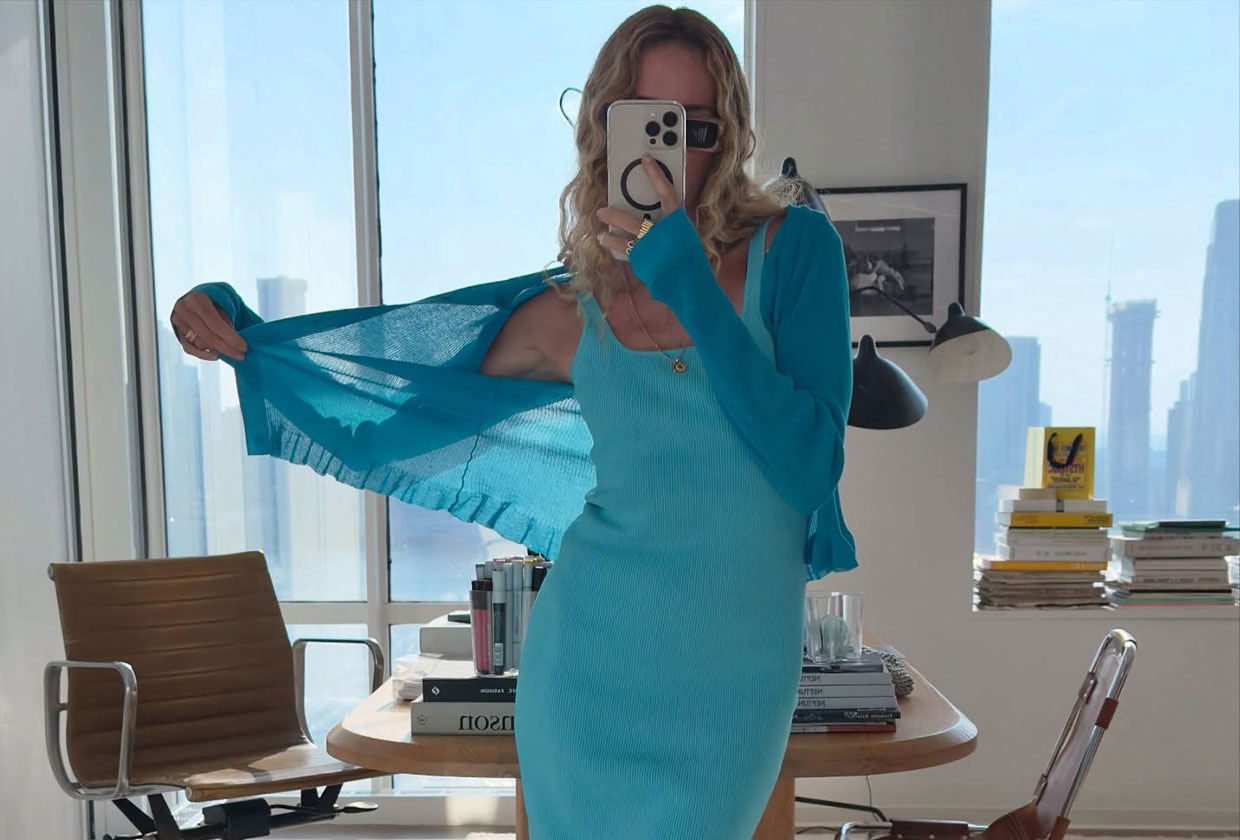 Olympia Gayot wearing a turquoise dress and blue cardigan from J.Crew.