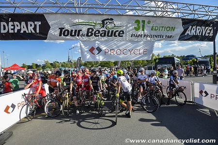Riders prepare to start the twilight race at Tour de Beauce