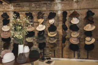 A photo of inside the Gigi Burris store of her many hats.