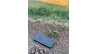 A phone lying on a trail