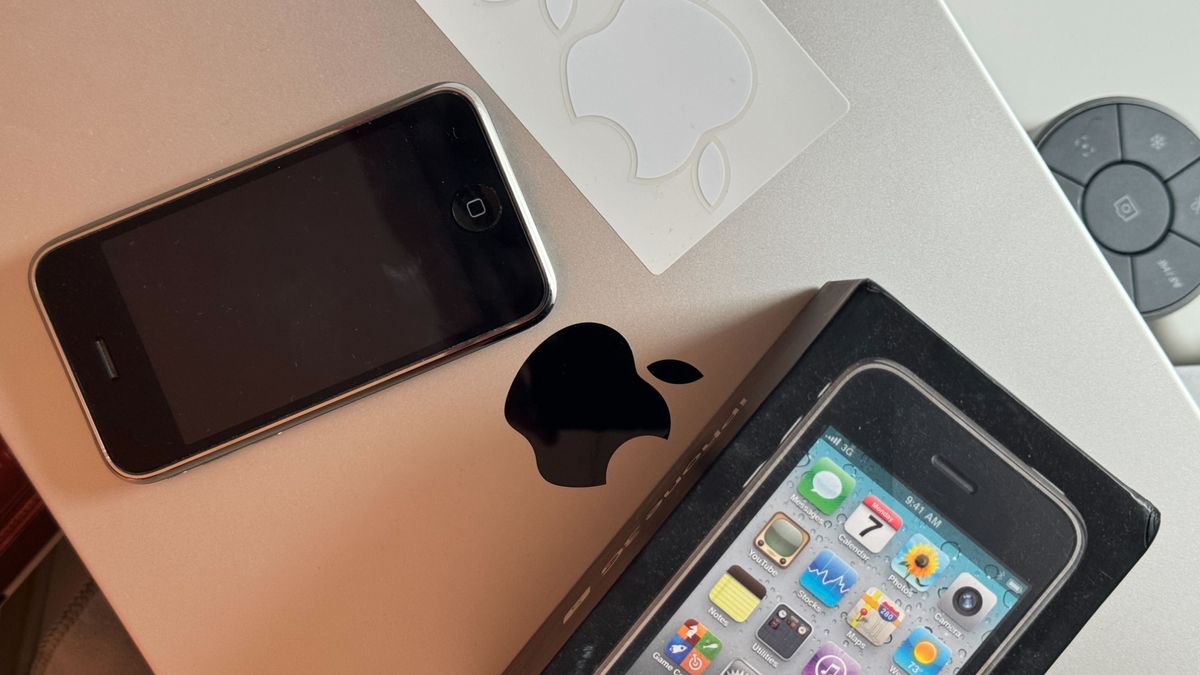 Apple stickers alongside an iPhone 3GS