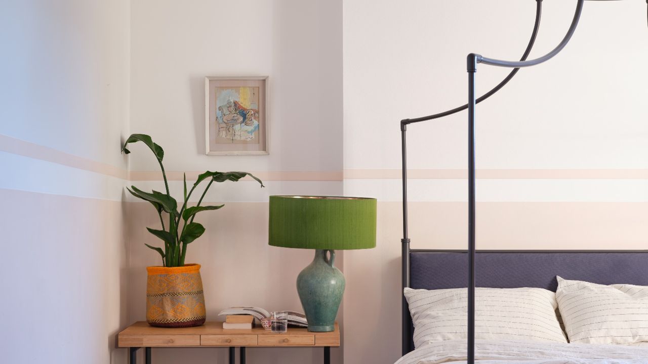 Farrow &amp; Ball&#039;s new shade Tailor Tack used in a bedroom with a wrought iron bed frame