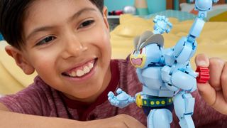 Kid playing with MEGA Pokemon Machamp toy