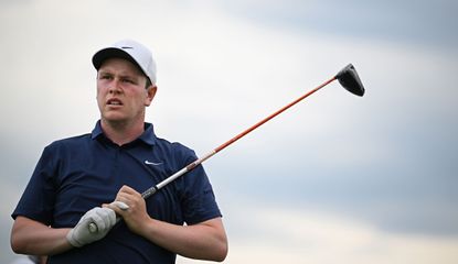 Robert MacIntyre watches his tee shot