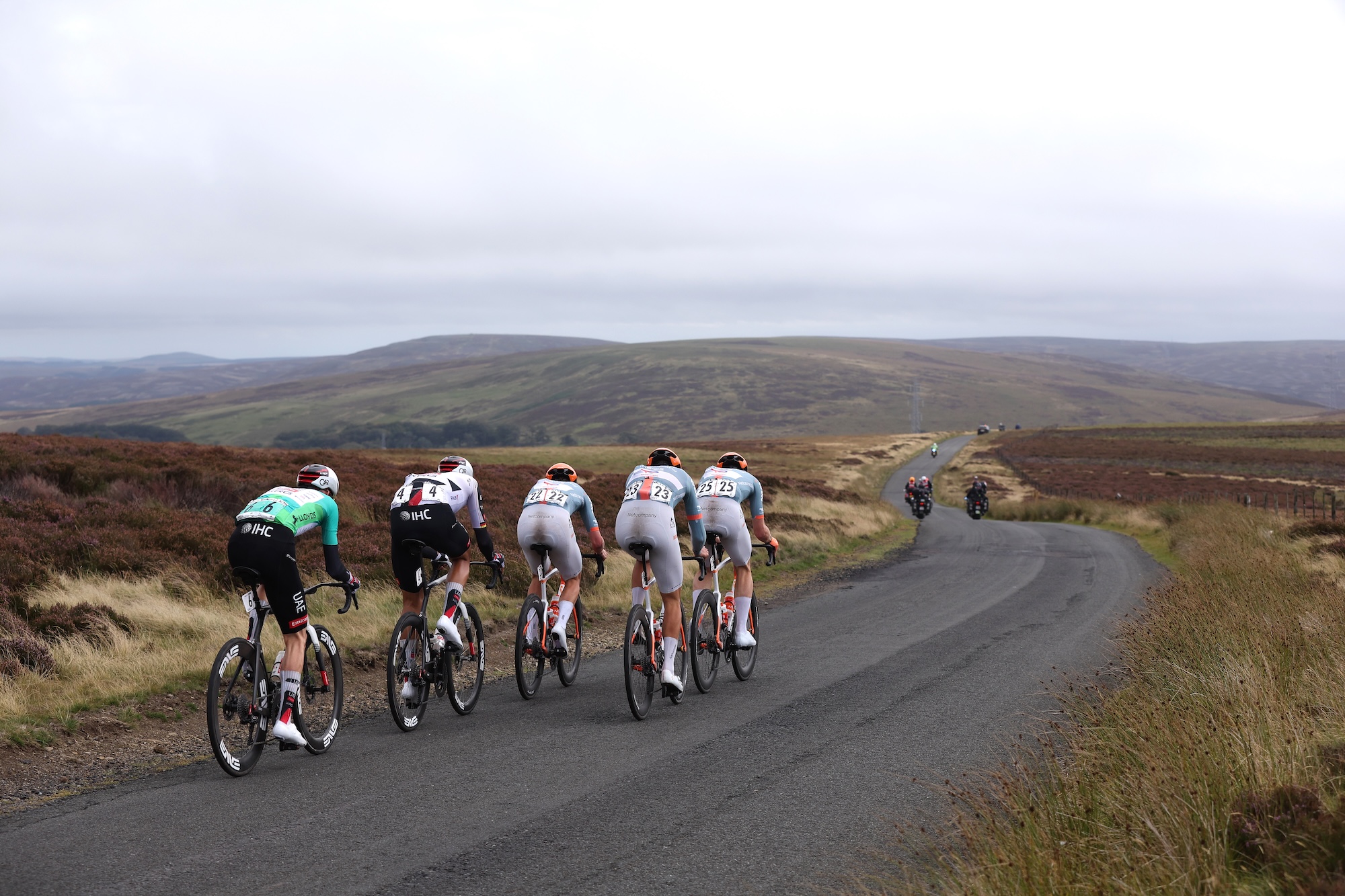 EARLSTON, UNITED KINGDOM - SEPTEMBER 06: (L-R) Tim Wellens - Green Leader Jersey - and Nils Politt, both of UAE Team Emirates - XRG, compete with trio of Netcompany riders