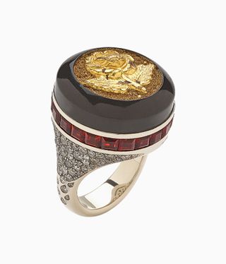 Black and diamond ring with a button set into it
