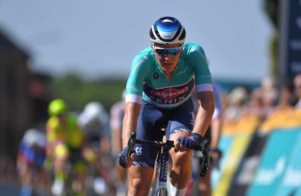 BILZEN BELGIUM SEPTEMBER 03 Tim Merlier of Belgium and Team AlpecinFenix Turquoise points jersey reacts after cross the finishing line during the 17th Benelux Tour 2021 Stage 5 a 188km stage from Riemst to Bilzen BeneluxTour on September 03 2021 in Bilzen Belgium Photo by Luc ClaessenGetty Images