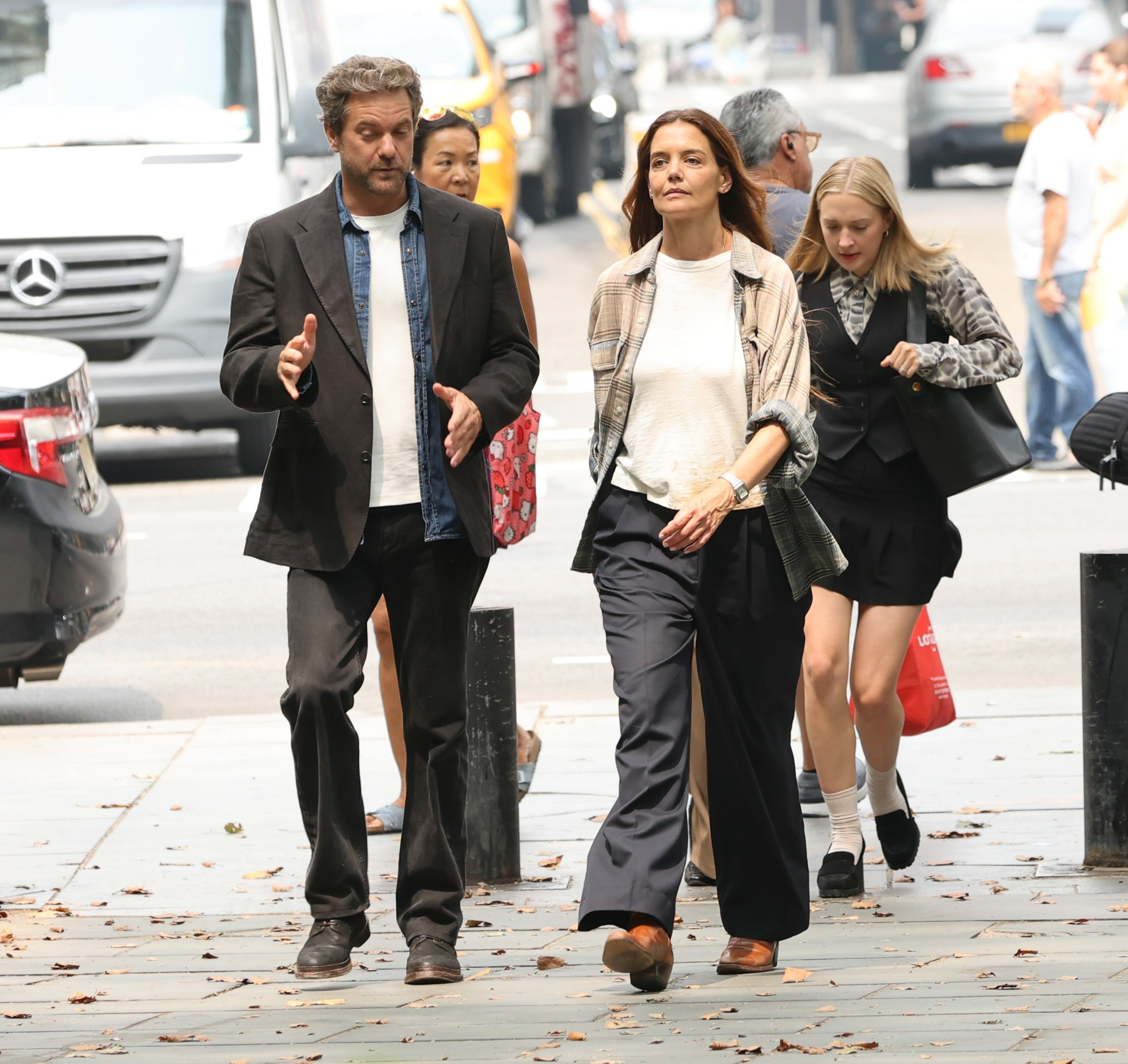 Katie Holmes layered a white T-shirt underneath an early fall flannel