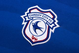 A close-up of the Cardiff City badge on a shirt