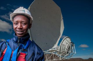 A worker pictured with a satellite dish in the Northern Cape, South Africa's largest province.