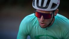 Oakley Sutro review: Pictured here. a cyclist wearing a helmet and the Oakley sunglasses