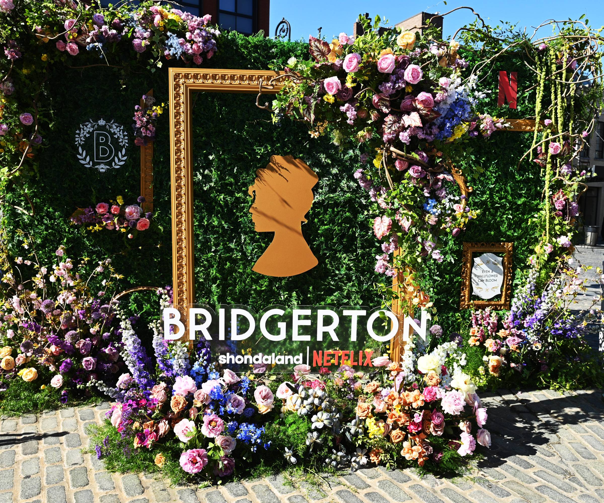 An outdoor flower display advertising Bridgerton