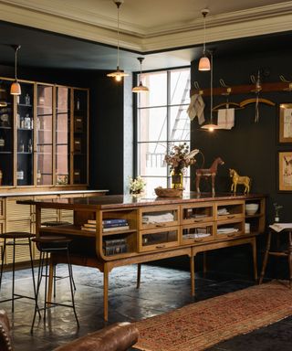 Wooden kitchen with glass fronted cabinets on the island