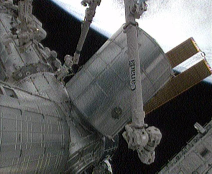 Shuttle Astronauts Move In Aboard Space Station