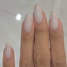 A close up of long nails