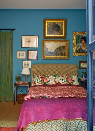 Gallery wall in a blue bedroom