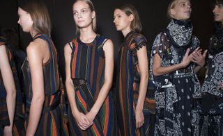 Models wearing colourful striped clothes