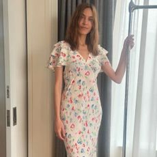 Alexa Chung wears a ruffle dress.