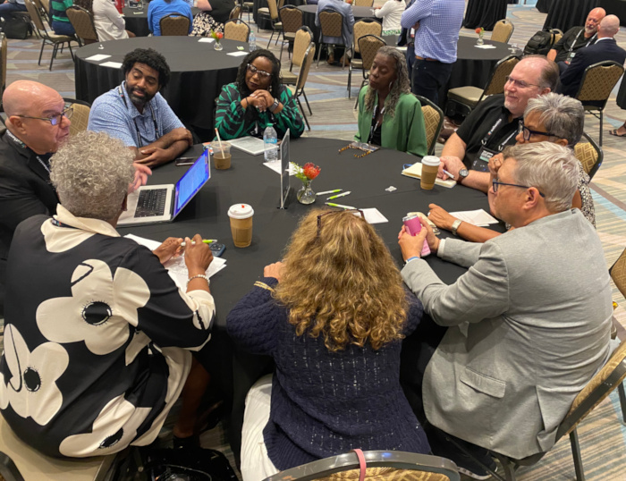 Attendees gathered around hot topics to discuss their challenges and successes.