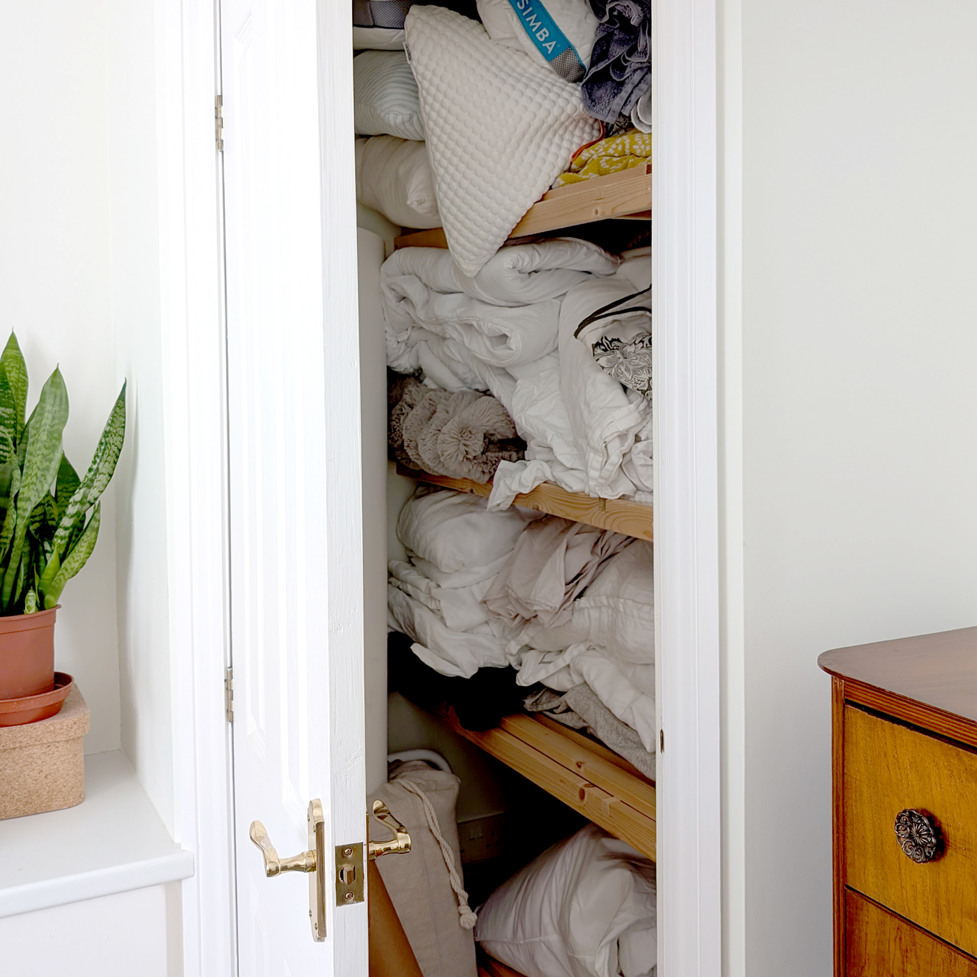 A linen cupboard bulging at the seams