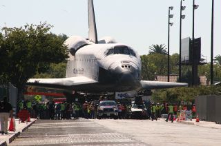 Space shuttle Endeavour is seen approaching the California Science Center at the end of its three-day, 12-mile (19 km) "Mission 26" road trip, Oct. 14, 2012.