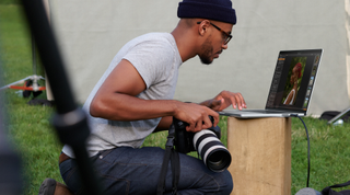 A photographer using the 2021 MacBook Pro with M1 Max chip
