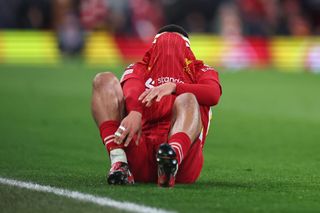 LIVERPOOL, ENGLAND - MARCH 11: Trent Alexander-Arnold of Liverpool goes off injured during the UEFA Champions League 2024/25 UEFA Champions League 2024/25 Round of 16 Second Leg match between Liverpool FC and Paris Saint-Germain at Anfield on March 11, 2025 in Liverpool, England. (Photo by Robbie Jay Barratt - AMA/Getty Images)