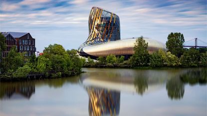 Reflection, Water, Architecture, Landmark, Natural landscape, Sky, Reflecting pool, Waterway, River, Tree, 