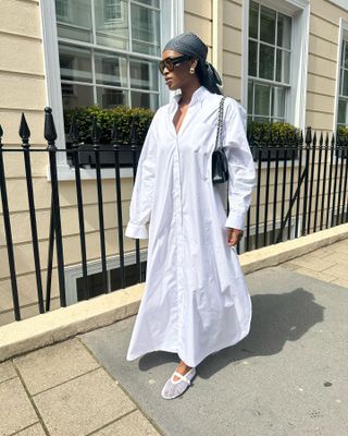 Woman in white dress and mesh flats.