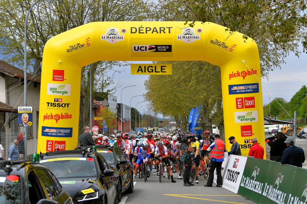 MARTIGNY SWITZERLAND APRIL 28 The peloton at start in Aigle city during the 74th Tour De Romandie 2021 Stage 1 a 1681km stage from Aigle to Martigny TDR2021 TDRnonstop UCIworldtour on April 28 2021 in Martigny Switzerland Photo by Luc ClaessenGetty Images