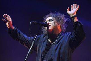Robert Smith of The Cure performs live on stage at Wembley Arena