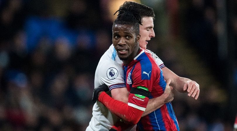 West Ham&#039;s Declan Rice holds Crystal Palace&#039;s Wilfried Zaha during a Premier League game in 2019.