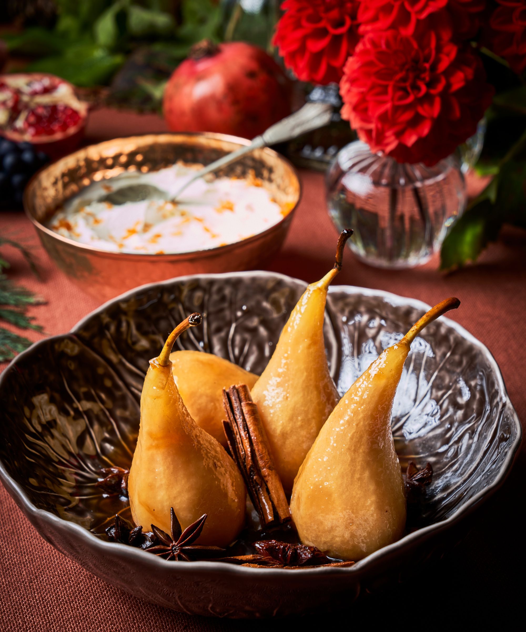 Bowl of poached pears on a Christmas table