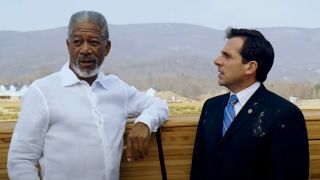 Morgan Freeman stands next to Steve Carell in front of a stack of wood in Evan Almighty.