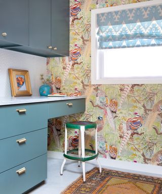 Office space with pheasant wallpapers and blue cabinetry