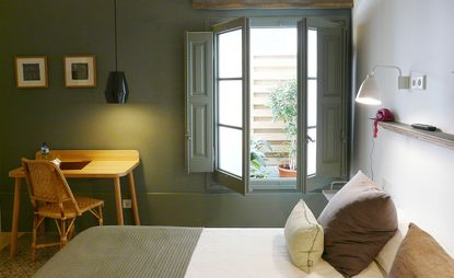 Sage green guestroom