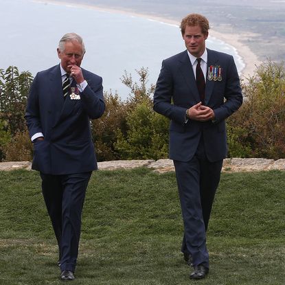 GALLIPOLI, TURKEY - APRIL 25: Prince Harry chats with Prince Charles, Prince of Wales during a visit to The Nek, a narrow stretch of ridge in the Anzac battlefield on the Gallipoli Peninsula, as part of commemorations marking the 100th anniversary of the Battle of Gallipoli on April 25, 2015 in Gallipoli,Turkey. Turkish and Allied powers representatives, as well as family members of those who served, are commemorating the 100th anniversary of the Gallipoli campaign with ceremonies at memorials across the Gallipoli Peninsula. The Gallipoli land campaign, in which a combined Allied force of British, French, Australian, New Zealand and Indian troops sought to occupy the Gallipoli Peninsula and the strategic Dardanelles Strait during World War I, began on April 25, 1915 against Turkish forces of the Ottoman Empire. The Allies, unable to advance more than a few kilometers, withdrew after eight months. The campaign cost the Allies approximately 50,000 killed and up to 200,000 wounded, the Ottomans approximately 85,000 killed and 160,000 wounded. (Photo by Niall Carson-Pool/Getty Images)