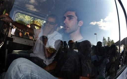 A shocked Spaniard Daniel Navarro (R) and his teammate and compatriot Antonio Colom
