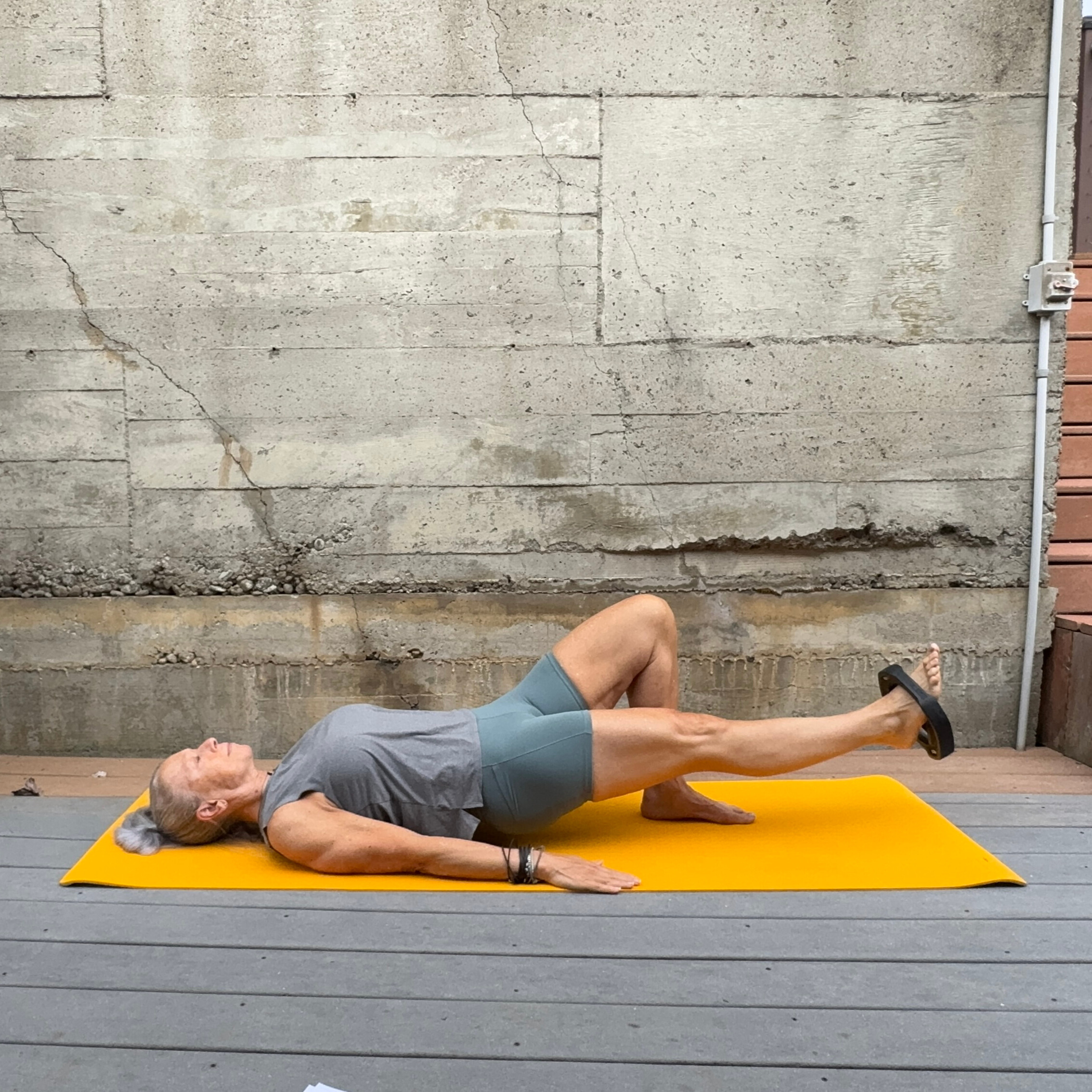 Woman exercising with weight plate