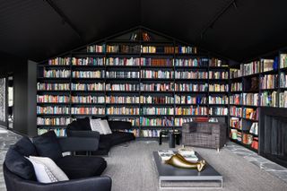 Home library, with floor-to-ceiling shelves filled with books